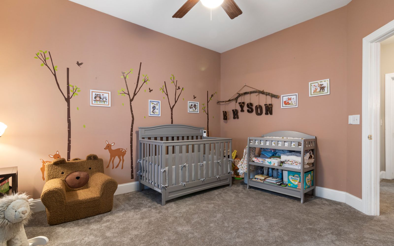 Pre-K classroom with reading nook, name labels, and a calendar wall